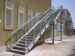 Industrial galvanized steel staircase with safety balustrades