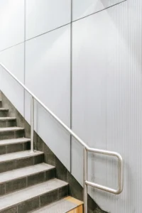 Stainless steel handrail installed on indoor staircase
